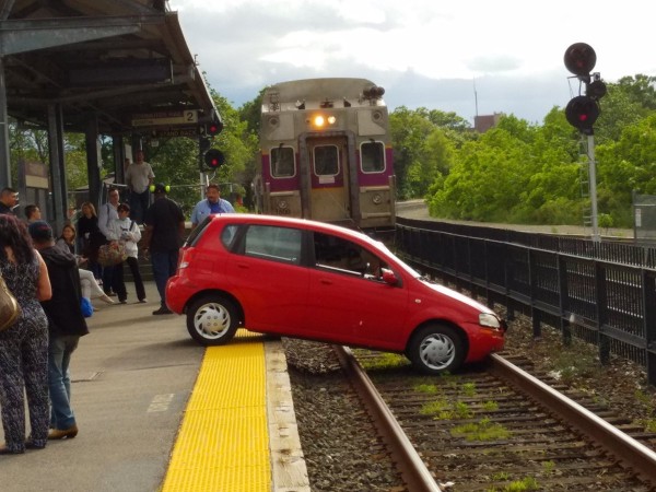 car on railroad tracks